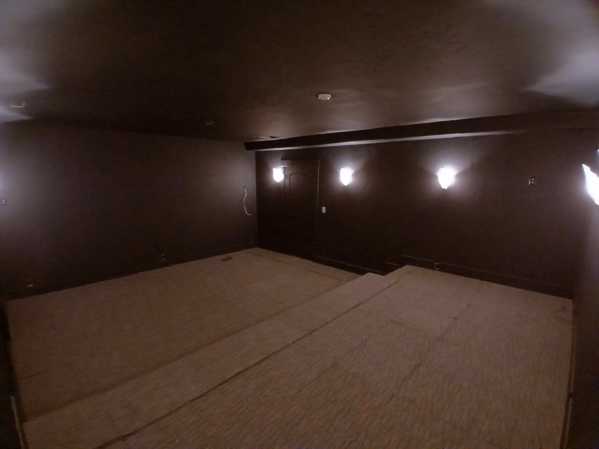 install mid-grade carpet in a theater room