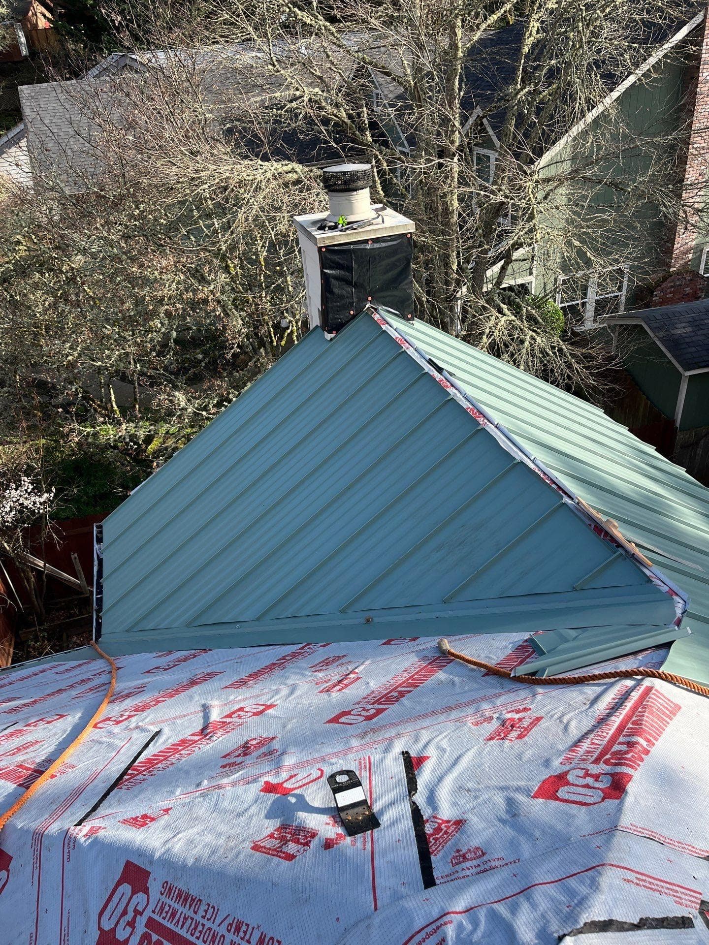 install a 24g metal roof with skylights and high-temp underlayment