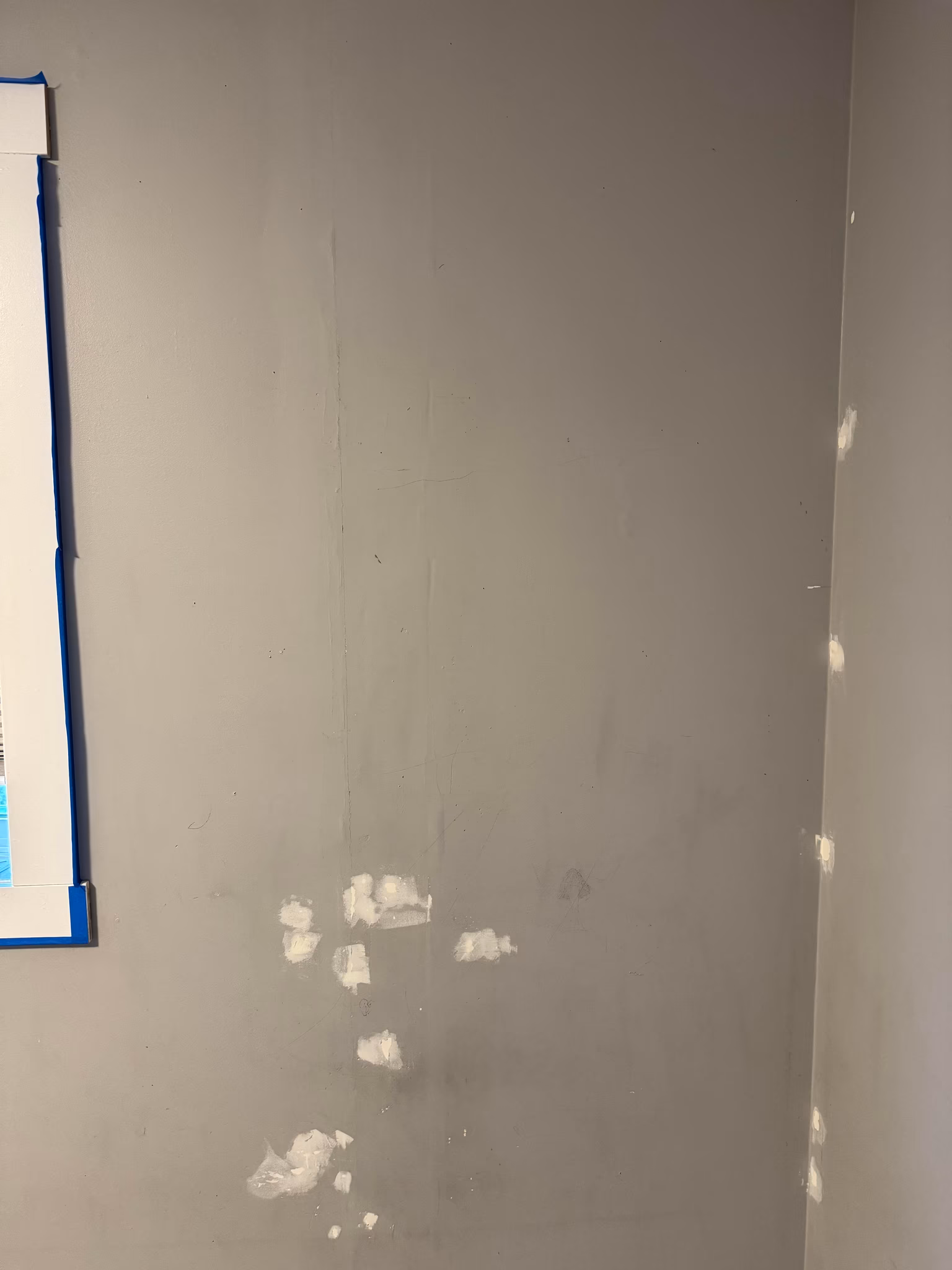 fix poorly done drywall on a roof and wall, mud, and paint the ceiling and walls