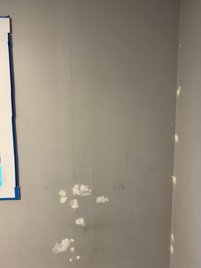 fix poorly done drywall on a roof and wall, mud, and paint the ceiling and walls