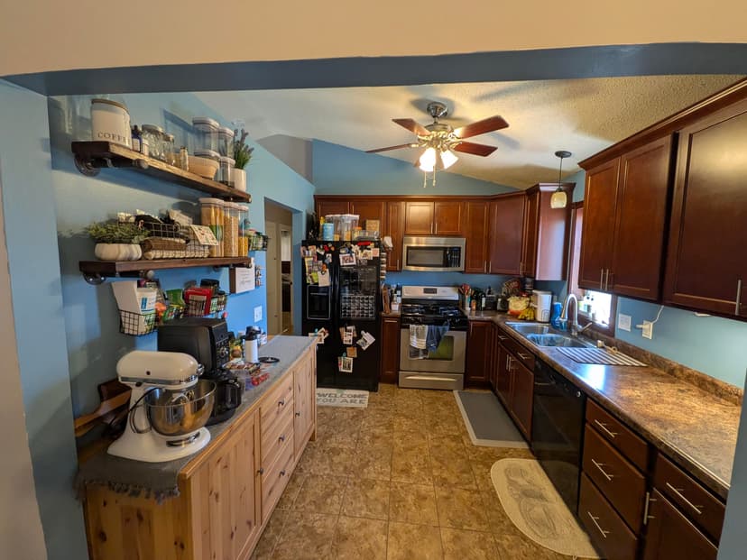 remodel kitchen, add island, and replace main floor flooring