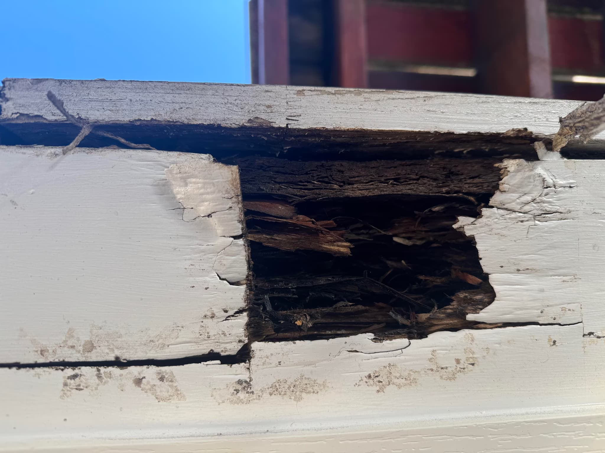 replace garage beams, roof, and siding