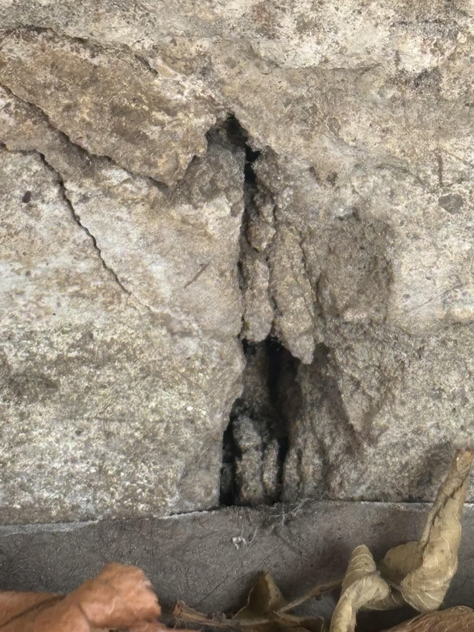 caulk and cement foundation cracks and install metal starter