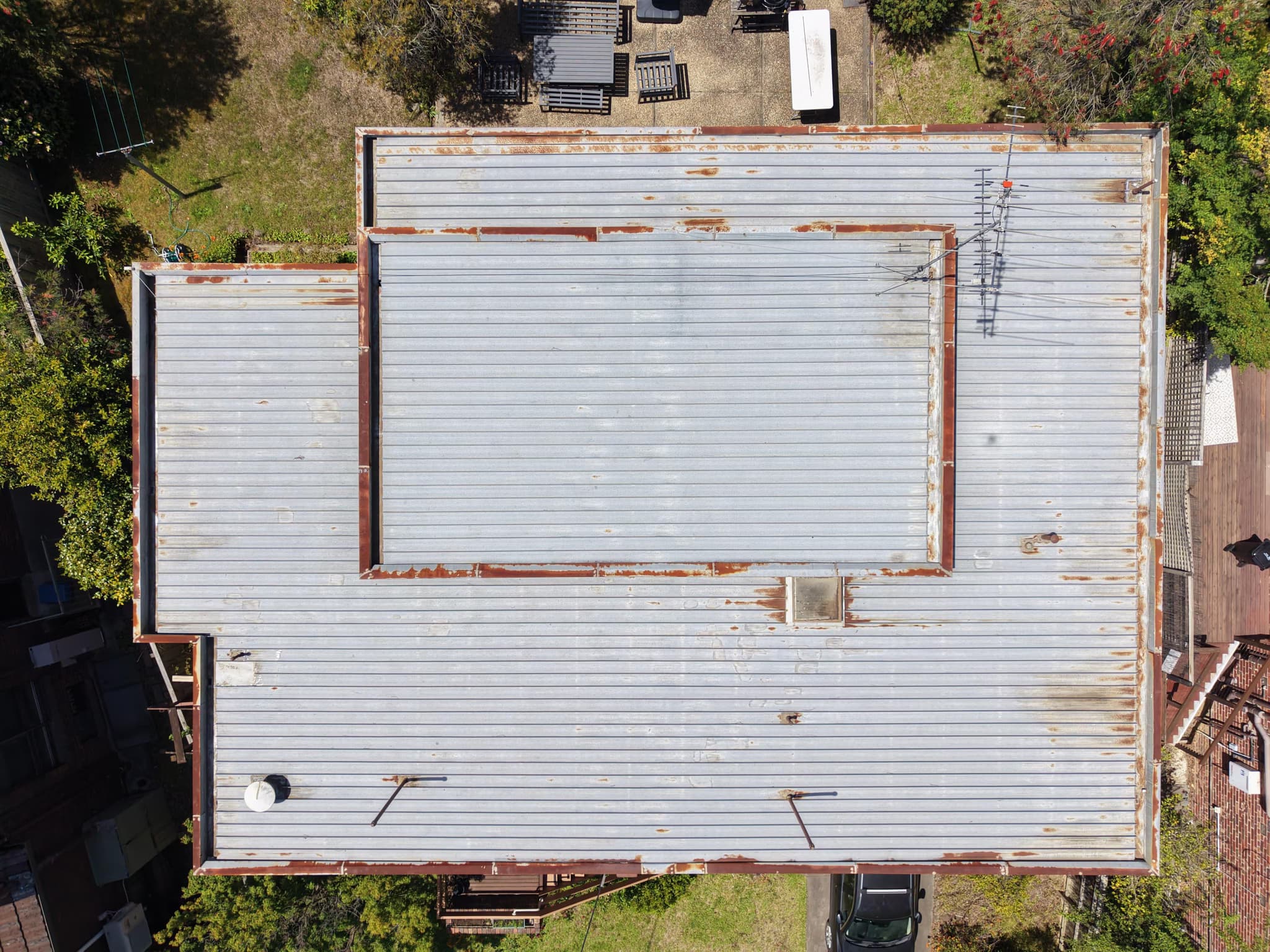 replace and raise a flat metal roof
