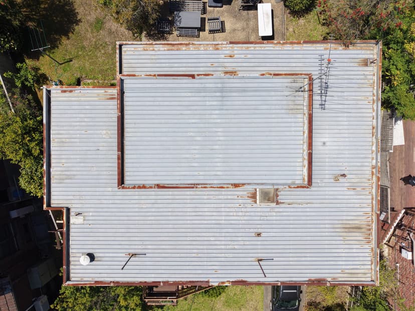 replace and raise a flat metal roof