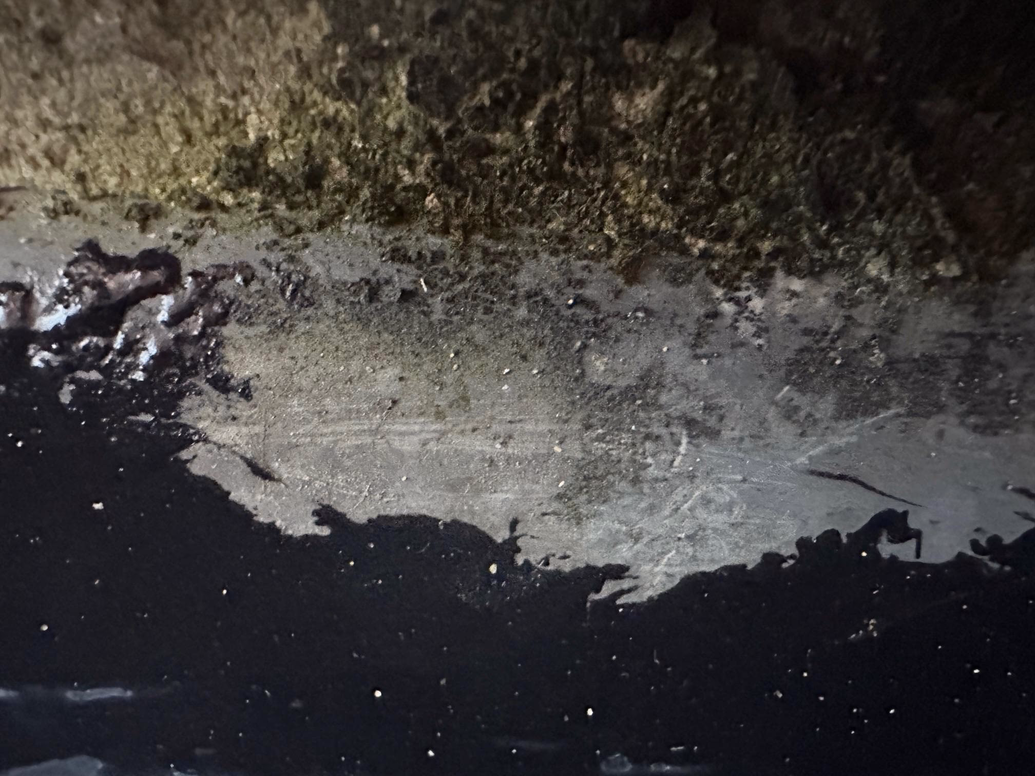 repair a leak around a parapet wall/gutter on a mansard roof