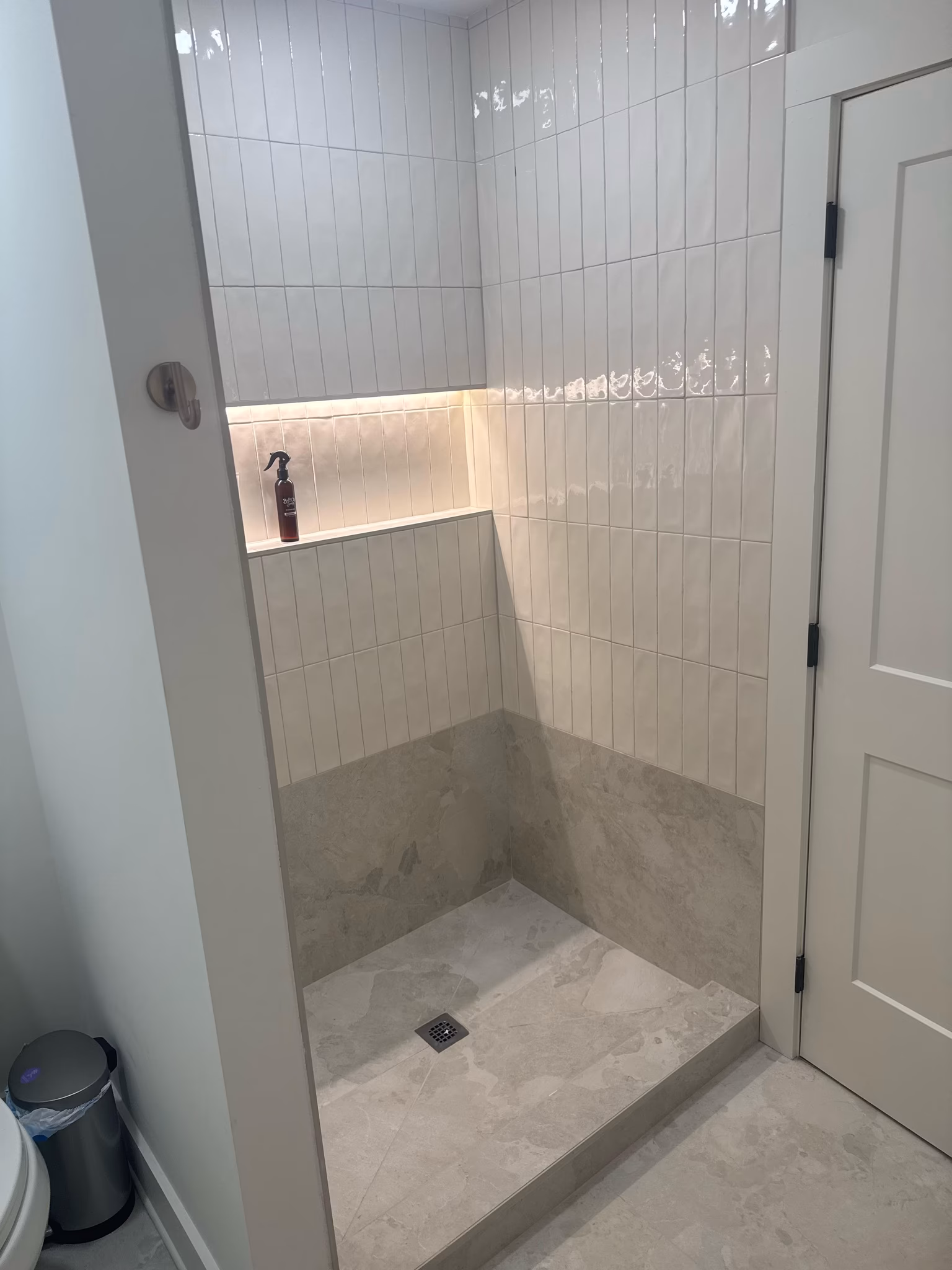 install a frameless shower door and stationary panel