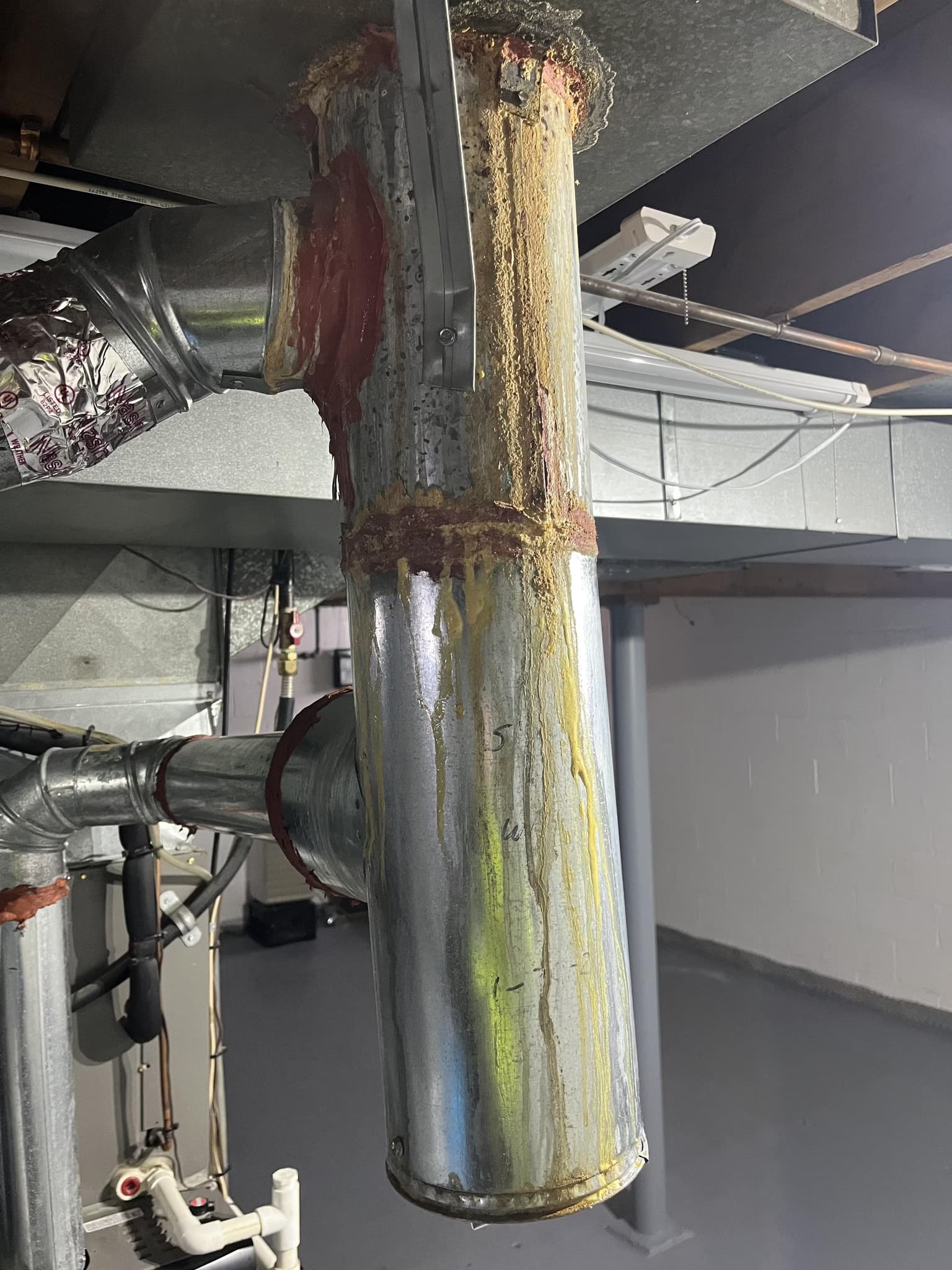 replace leaky flue and remove asbestos