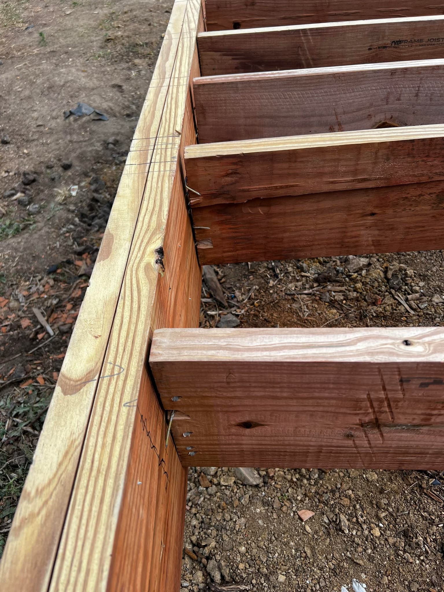 build a 600 sqft deck with pavers and hot tub pad, including tear down of existing 400 sqft deck