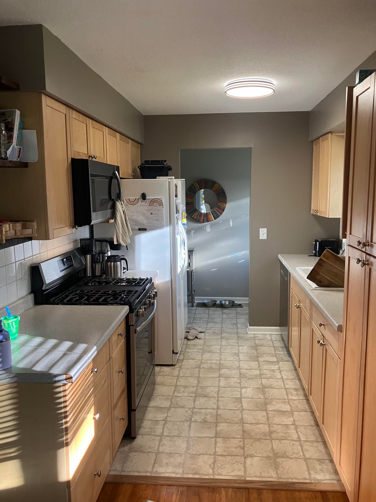 replace laminate counters and tile with granite and new tile, and install an undermount sink