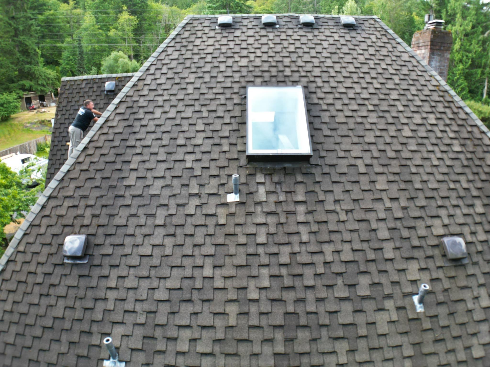 perform roof repairs including ridge shingle replacement, cleaning, and vent trimming