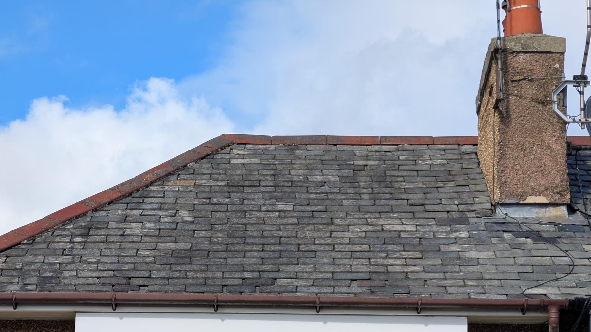 strip back tiles next to chimney and on the side roof to find source of leaks