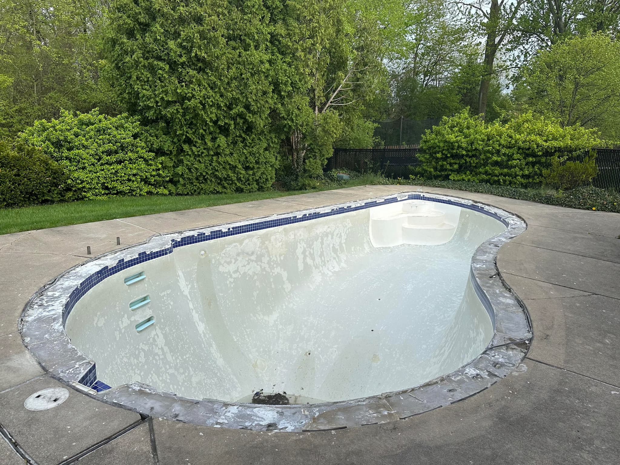 resurface pool with standard coping, tiles, and marcite