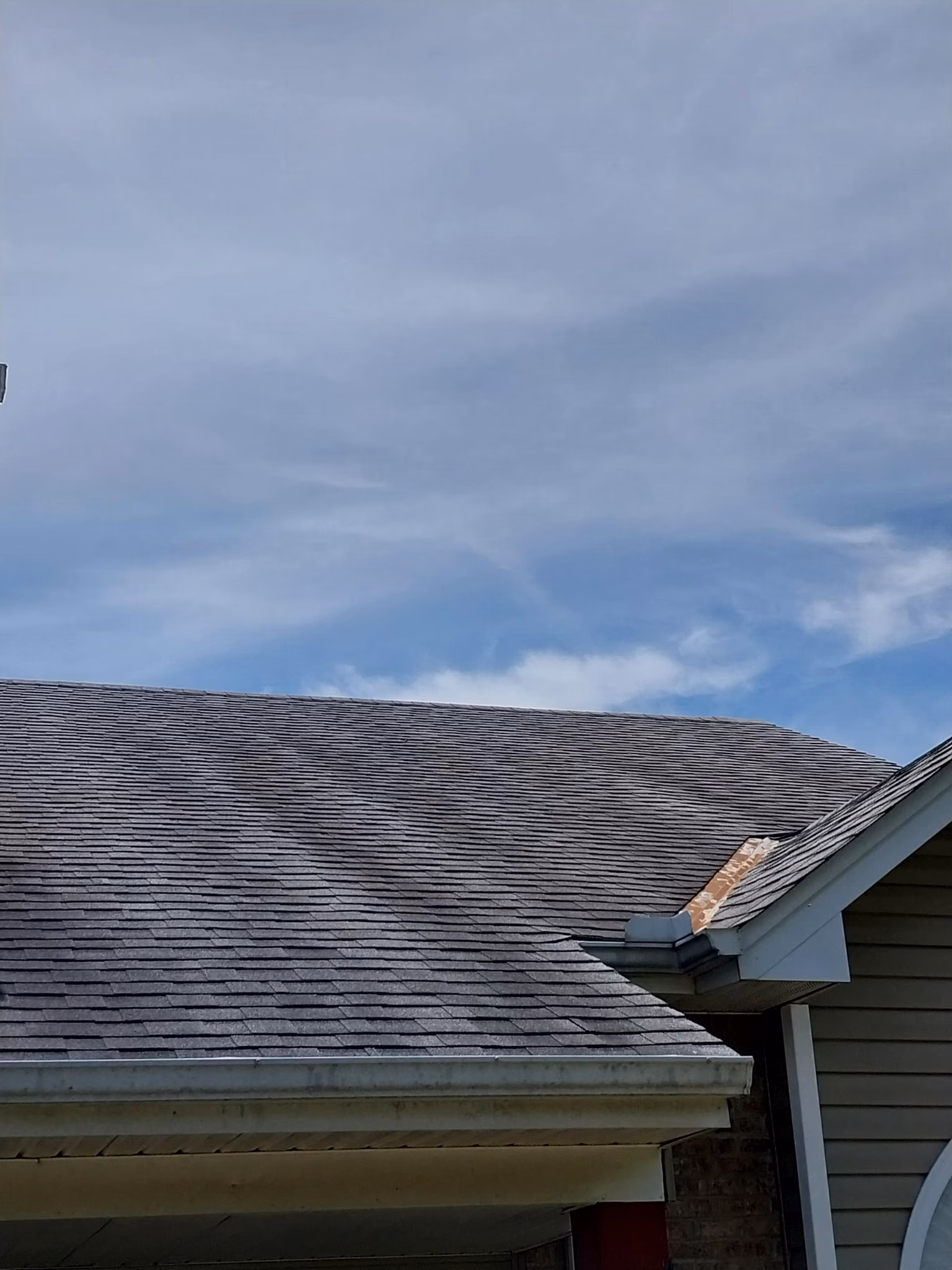 replace roof with 50 year shingles and install new gutters