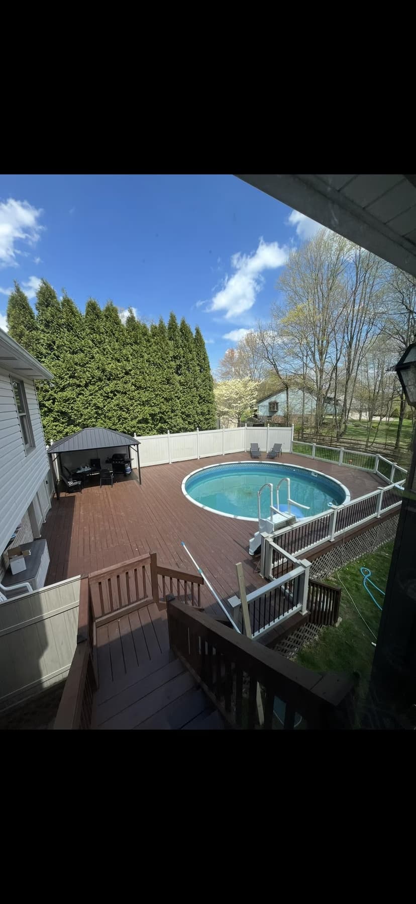 redeck the deck boards in composite, rebuild steps, new railing, and privacy fence