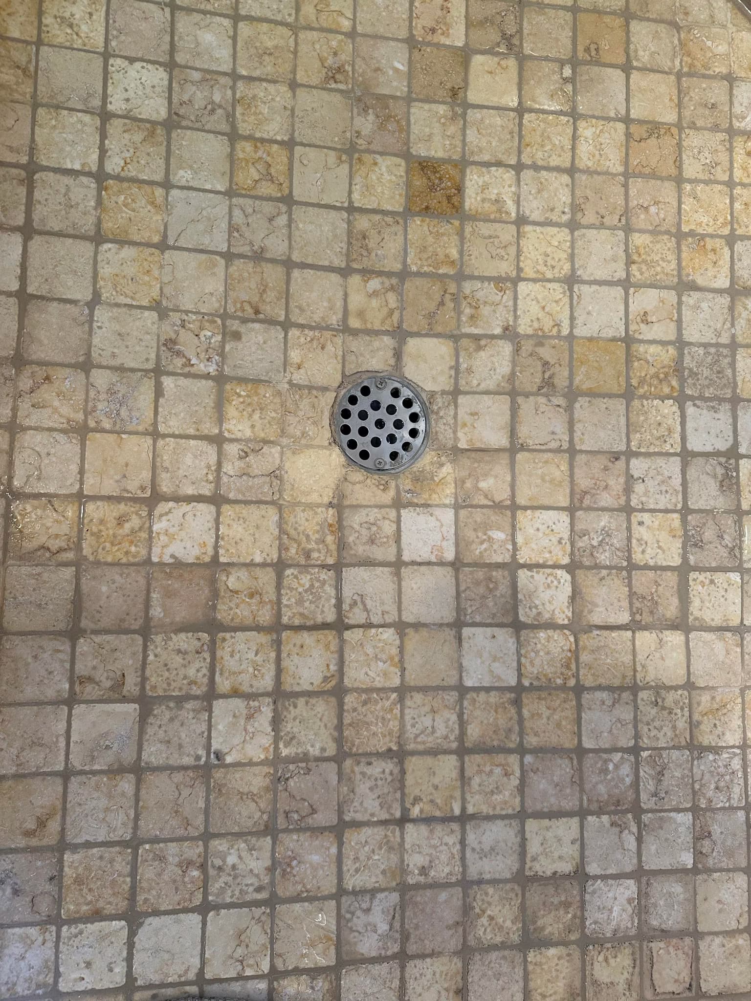 remove and re-grout my shower floor