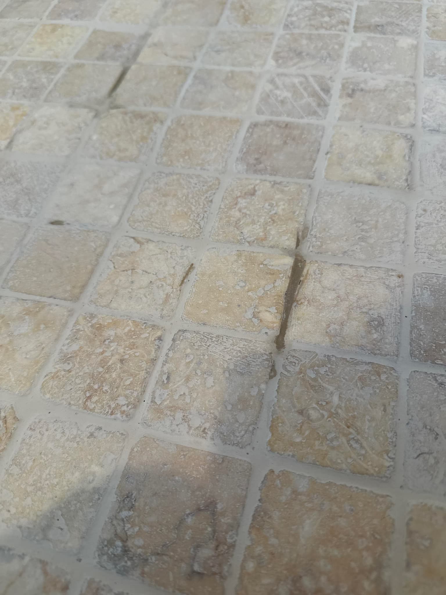 remove and re-grout a shower floor