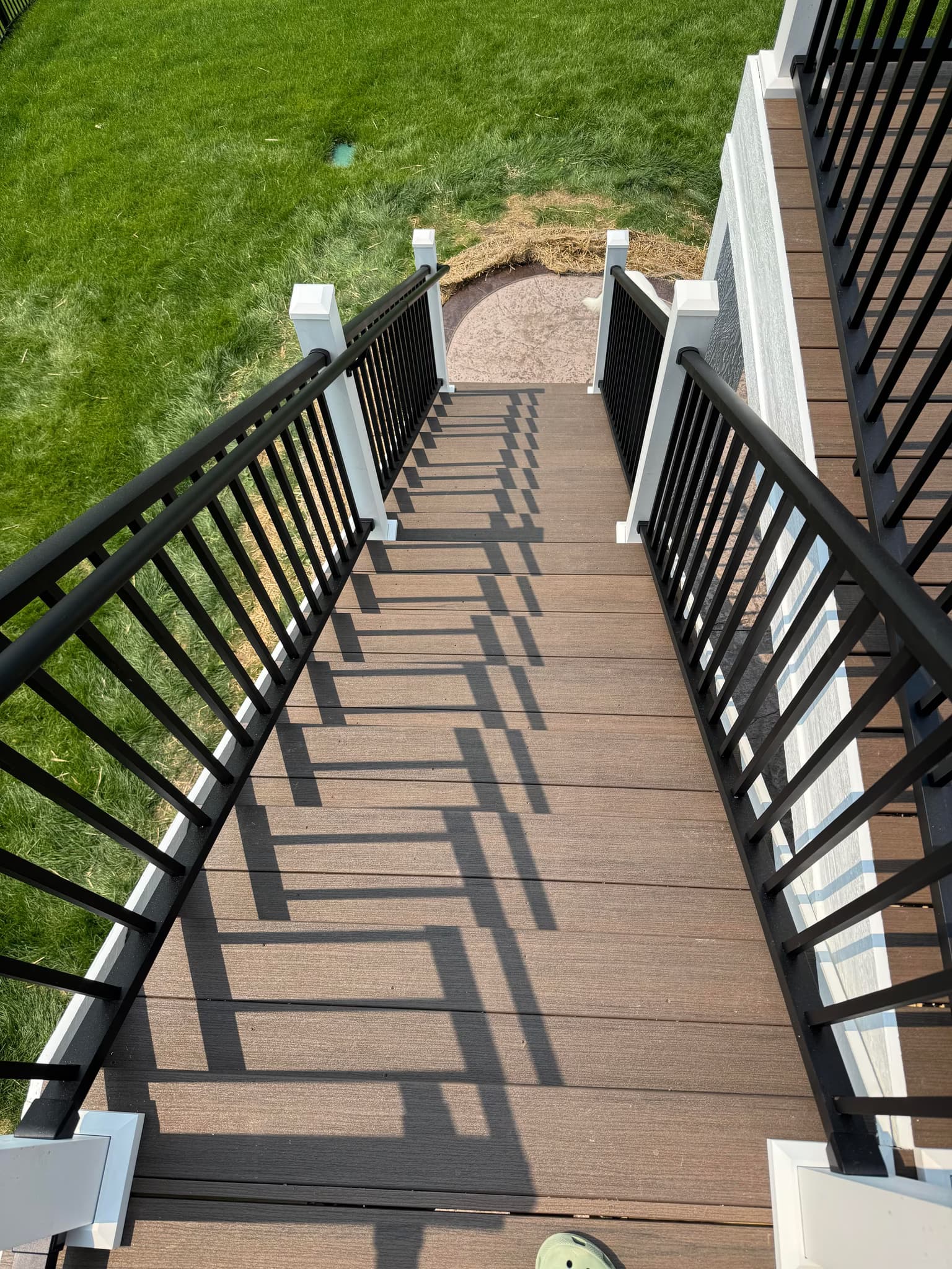 build a 14x28 deck with a stamped concrete patio underneath