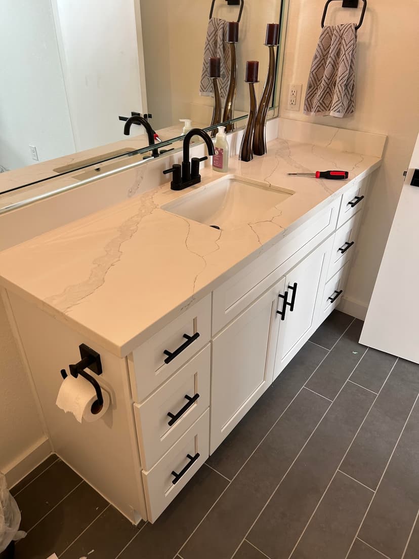 mitigate water damage and reconstruct bathroom vanity area