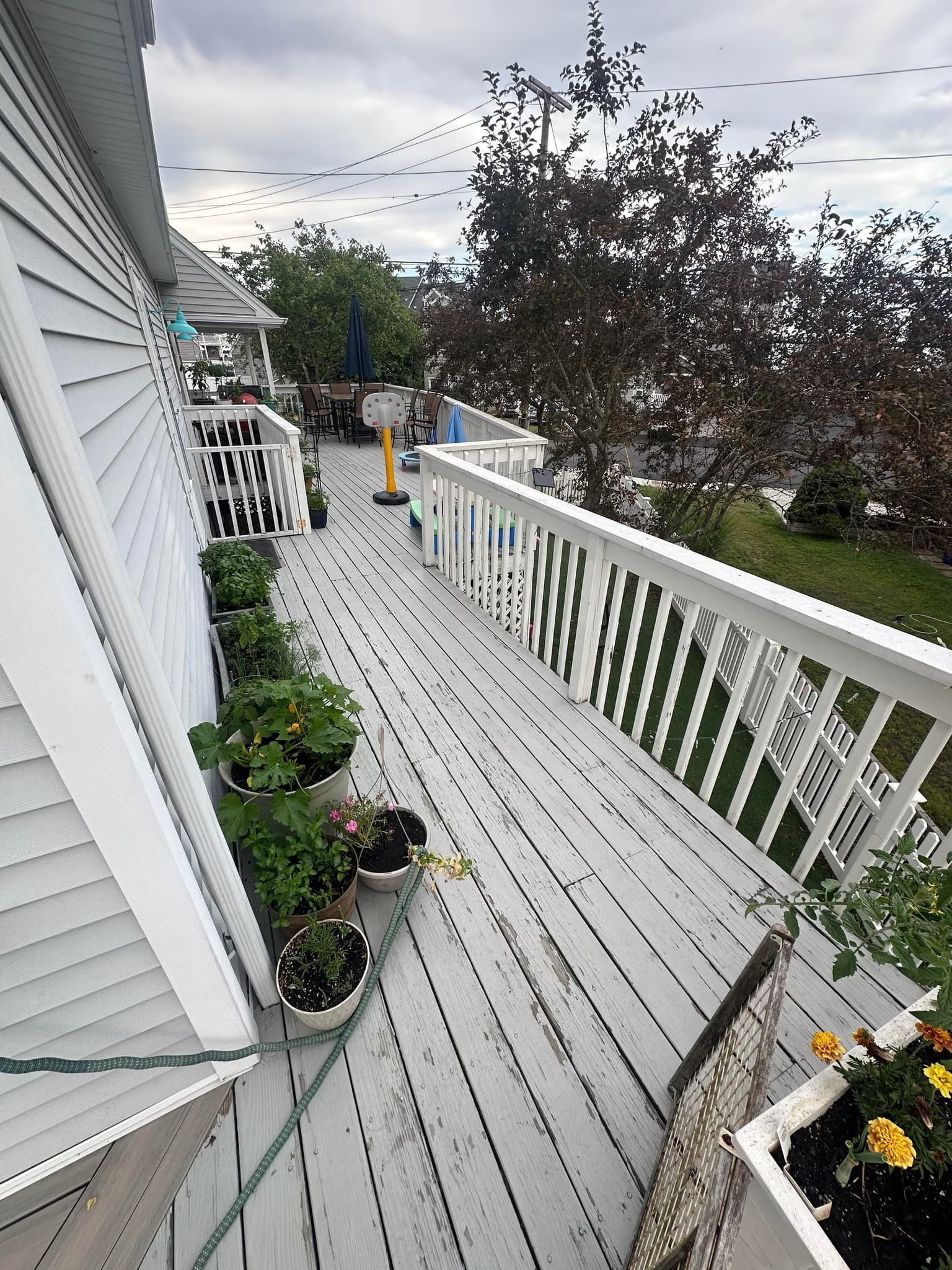 resurface a wraparound wood deck