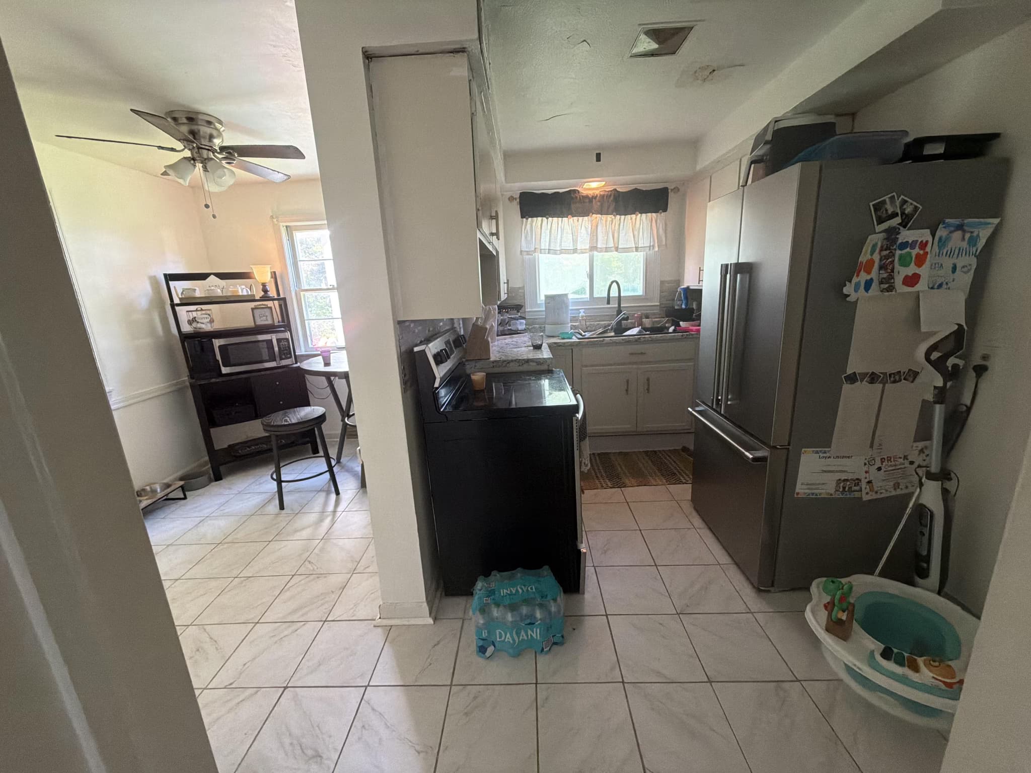remove kitchen wall, reroute vent, repair ceiling, and install countertops