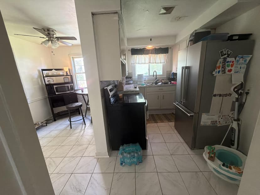 remove kitchen wall, reroute vent, repair ceiling, and install countertops