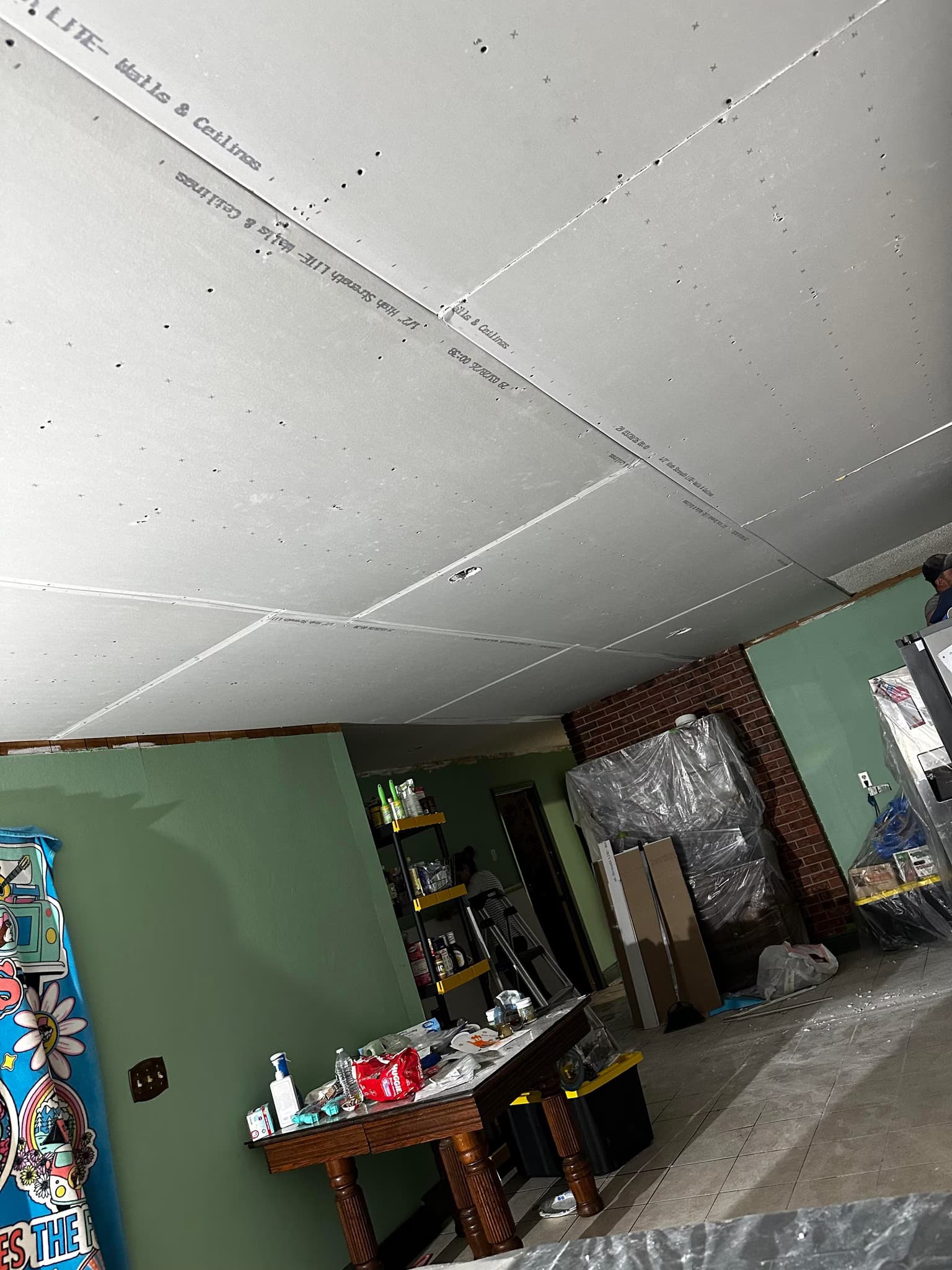 install 1/4 drywall overlay with level 5 finish on ceilings