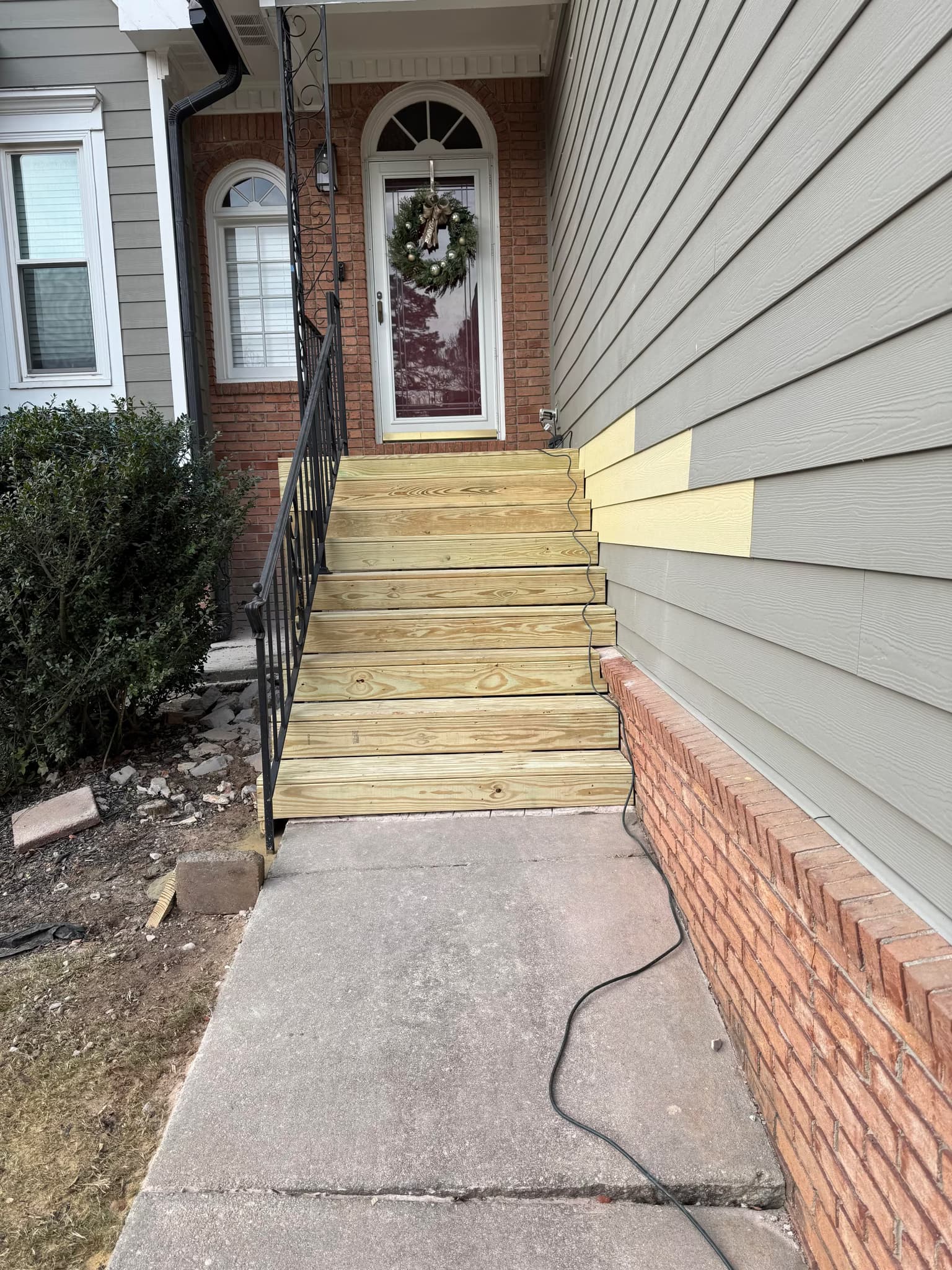 replace a sinking front brick porch with a 5x6 wooden porch and stairs